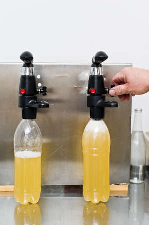 Bottling factory - Beer bottling line for processing and bottling beer into bottles.の写真素材