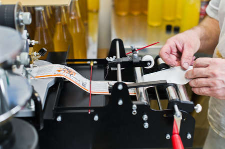 30.03.2019 Russia, St. Petersburg - Moving Bottles on Labelling machine for Industry, food industry, conveyor lineのeditorial素材