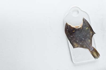 Raw flounder. White background, top view, space for textの写真素材