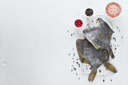 Raw flounder. White background, top view, space for textの写真素材