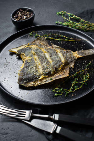 Grilled plaice, balanced healthy food. Gray background, top view, space for textの写真素材