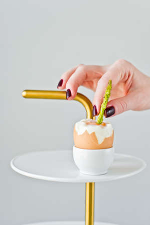 The concept of cooking eggs and asparagus