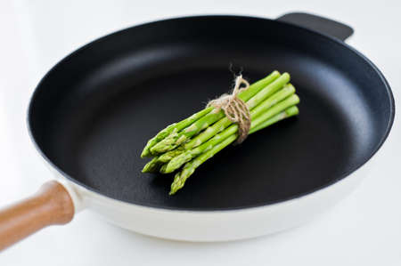 Organic mini asparagus. White background, top view, space for textの写真素材