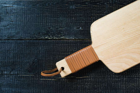 wooden cutting Board on black background