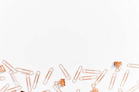 Paper clips copper color on white backgroundの写真素材