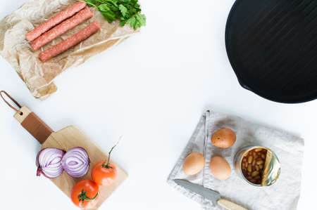 The concept of cooking an English Breakfast on a white background and space for textの写真素材