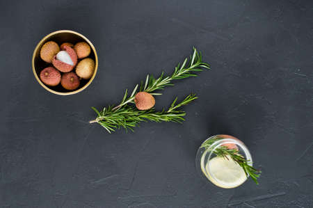 glass of clear water with lemon, rosemaryの写真素材