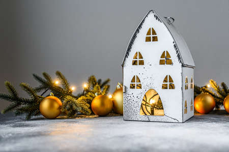 Christmas background, candlestick house with lights, fir branches and Christmas toys. Happy new yearの写真素材