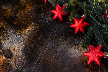 Happy New Year 2020. Christmas background with xmas tree, red stars and glowing golden bokeh lights on background. Space for text. selective focus.の写真素材