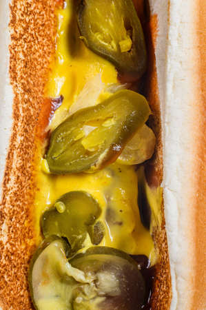 Hot dog with beef sausage in a cardboard box, food delivery concept. Junk food. Close upの写真素材