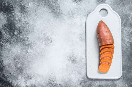 Raw yam, organic batatas. The farm vegetables. Gray background. Space for text.の写真素材