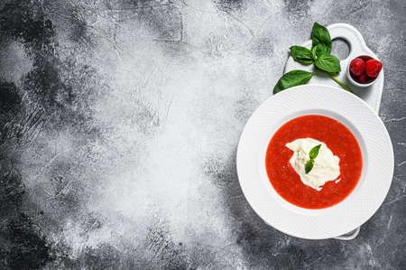 Dessert of strawberry puree and stracciatella mozzarella. Gray background. Space for text.の写真素材