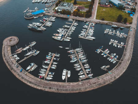 Aerialphoto yacht club with a breakwater. Yachts, motor boats, sailboats, berths, piers