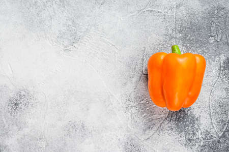Orange, yellow sweet pepper. Gray background. Top view. Space for textの写真素材