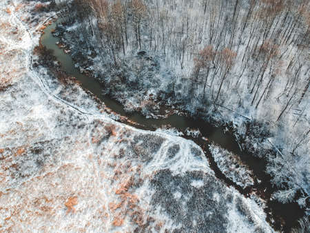 Aerial view of the forest and river at winter. Trees are covered with snow. Winter. snow-covered fields. Finland.の写真素材