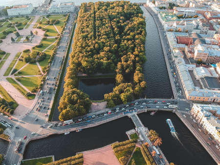 Aerial photo of the Summer garden, roads, trees, river Moika. Russia, St. Petersburg. Setting sun