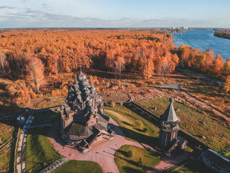 Aerial view of the Old wooden Church Manor Theologian in the autumn forest. Russia, St. Petersburgの写真素材