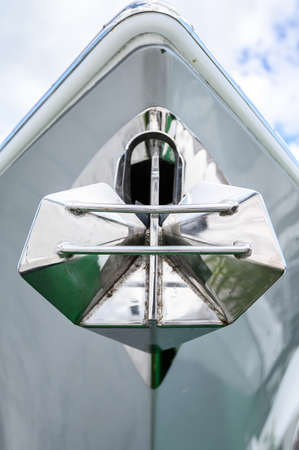 Polished new anchor on the yacht. Close up. Tenerife, Canary Islands, Spain.