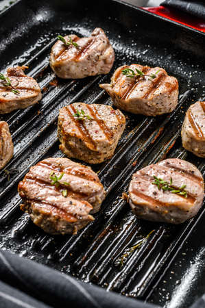 Tender boneless grilled pork chops. steak tenderloin. gray background. Top view.の写真素材