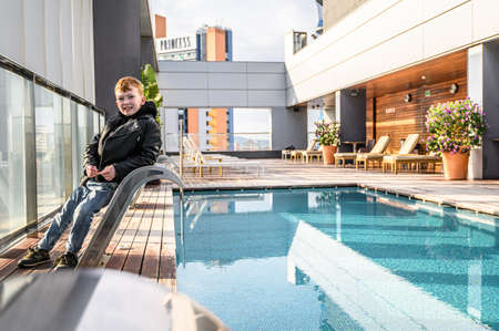 Swimming pool on roof top with beautiful city view of the skyscrapers. . Premium hotel. 03.01.2020...