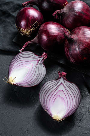 Red onion, onion halves. Black background. Top viewの写真素材