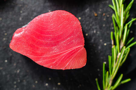 Raw fillet steak tuna. Black background. Top view. Close up.の写真素材