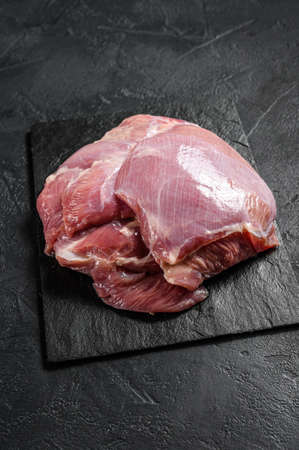 Raw Turkey thigh fillet. Farm eco meat. Dark background. Top view.の写真素材