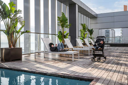 Swimming pool on roof top with beautiful city view of the skyscrapers. . Premium hotel. 03.01.2020...
