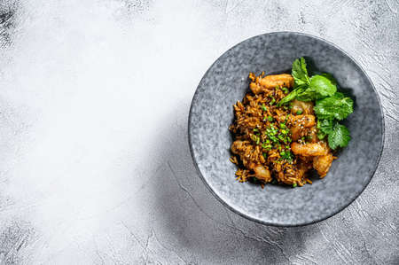 fried rice with spicy sauce and shrimps, prawns. White background. Top view. Copy space.の写真素材