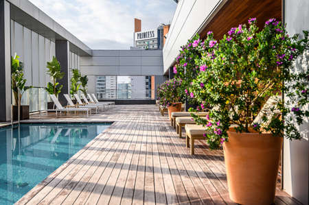 Swimming pool on roof top with beautiful city view of the skyscrapers. . Premium hotel. 03.01.2020 Barcelona, Spain.のeditorial素材