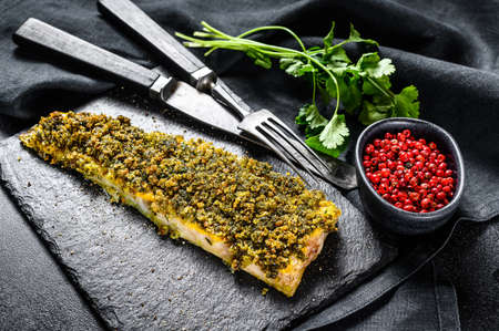 Fried fish fillet hake. Organic seafood. Black background. Top viewの写真素材