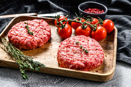 The ground beef patties, minced meat cutlets. Gray background. Top view.の写真素材