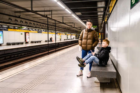 Interior of underground metro station. People on the platform. 03.01.2020 Barcelona, Spain.のeditorial素材