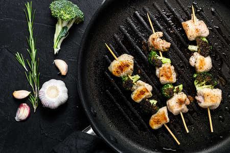 Barbecued Turkey breast skewers. Shish kebab. Black background. Top view.の写真素材