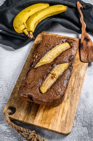 Homemade Banana chocolate Bread with Nut. Gray background. Top viewの写真素材