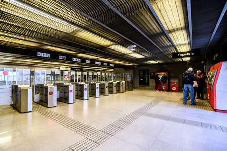 Turnstiles in the underground metro, ticket machine. 03.01.2020 Barcelona, Spain.