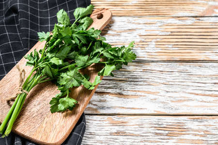 Organic parsley. A bunch of fresh herbs. White background. Top view. Copy spaceの写真素材