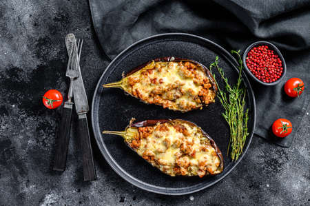 Baked eggplant with ground beef and cheese. Black background. Top view.の写真素材