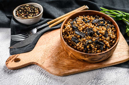 Buckwheat porridge with mushrooms. Vegan food. Russian, Ukranian cuisine. Gray background. Top view.の写真素材