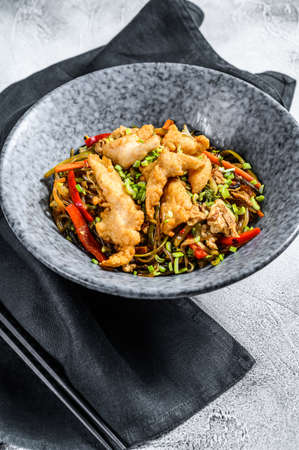 Stir-fry Glass noodle with chicken fillet and vegetables. White background. Top view.の写真素材