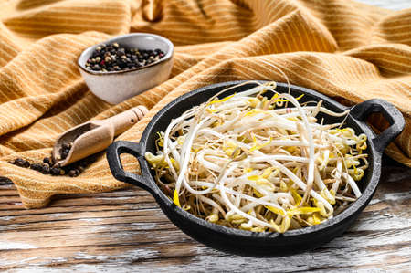 Bowl with Mungbean Sprouts on wooden background. White background. Top view.の写真素材