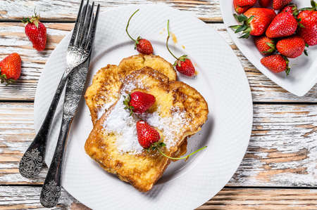 French Toasted with strawberry. Healthy Breakfast. White background. Top view.の写真素材