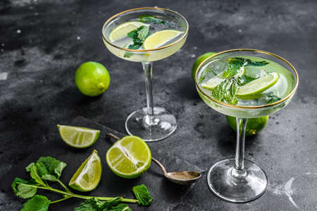 Mojito cocktail, Refreshing mint with rum and lime, cold drink or beverage. Black background. Top view.の写真素材