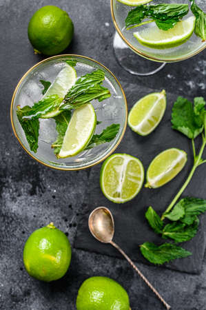 Mojito cocktail, Refreshing mint with rum and lime, cold drink or beverage. Black background. Top view.の写真素材