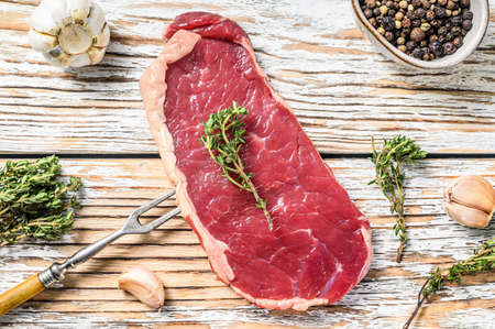 Raw Striploin, strip loin steak or new York. Meat beef. White background. Top view.の写真素材