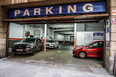 Filled underground Parking in the front of the house in the city center. 03.01.2020 Barcelona, Spain.のeditorial素材