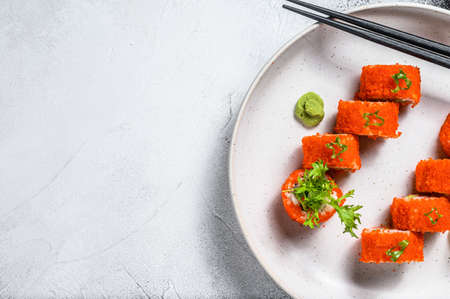 Sushi Maki roll with avocado and shrimp meat. Gray background. Top view. Copy spaceの写真素材