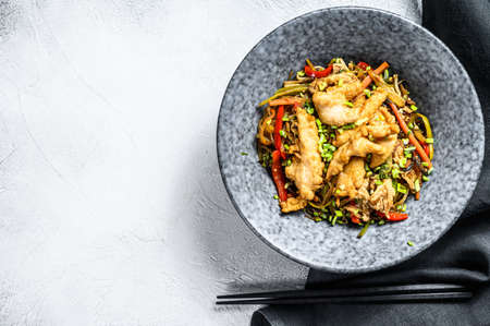 Stir-fry Glass noodle with chicken fillet and vegetables. White background. Top view. Copy space.の写真素材