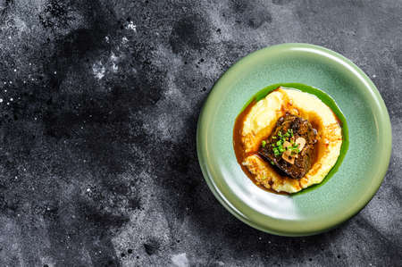Beef fillet steak with mashed potatoes. Black background. Top view. Copy space.の写真素材