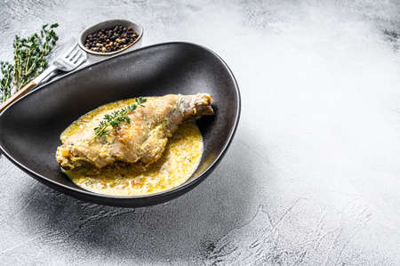 Stew with hare legs with rosemary and garlic. Gray background. Top view. Copy space.の写真素材